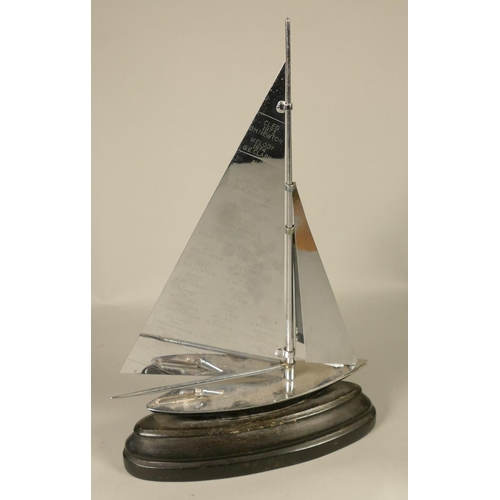 384 - A Parker Sailboat strike table lighter, chrome sails and deck, ebonised hull and base, presentation ... 