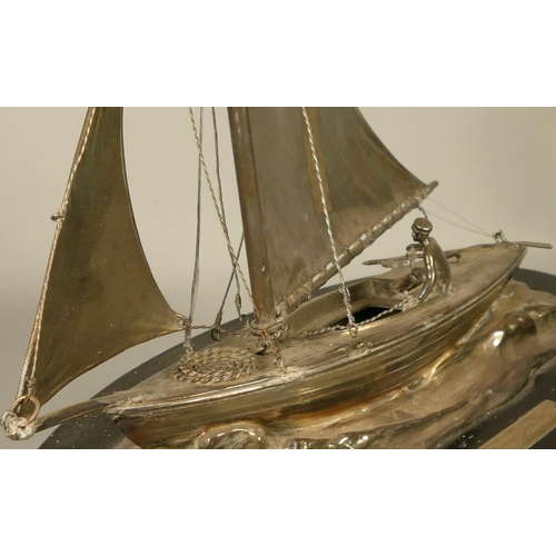 385 - An electoplated sailing presentation trophy, in the form of a gaff rigged, clinker built, vintage di... 