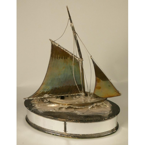 385 - An electoplated sailing presentation trophy, in the form of a gaff rigged, clinker built, vintage di... 