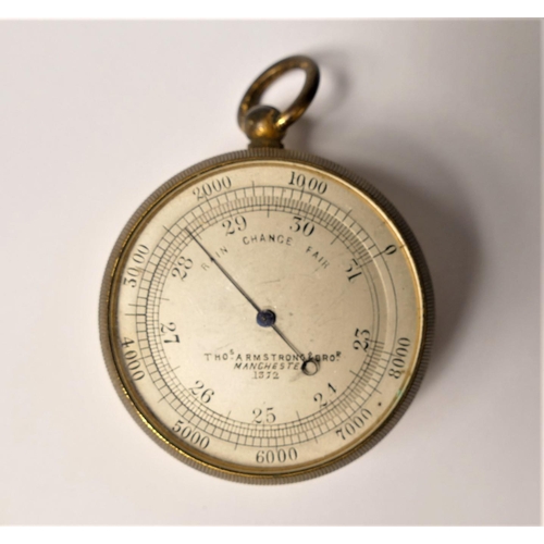 405 - A brass pocket barometer, by Thos. Armstrong, Manchester, numbered 1372, 45mm, case