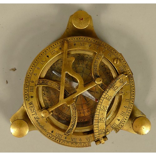 417 - WITHDRAWN    

West, London, a brass replica nautical sundial, 3 1/2