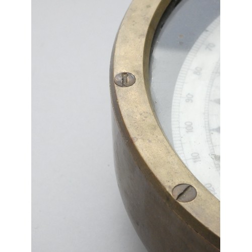 390 - A brass mounted ships compass, dial worn, diameter 25cm.