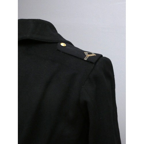 420 - A Mercantile Marine officers overcoat, with cap, braid and spare buttons, 48cm across the shoulders