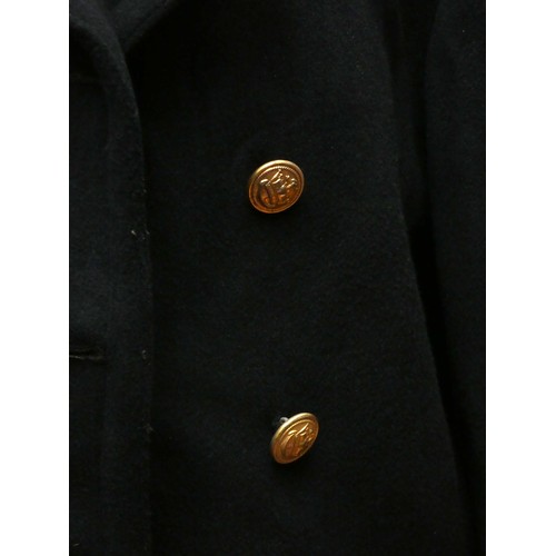 420 - A Mercantile Marine officers overcoat, with cap, braid and spare buttons, 48cm across the shoulders