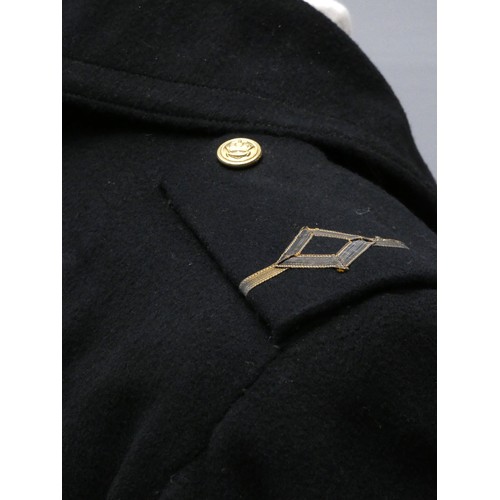 420 - A Mercantile Marine officers overcoat, with cap, braid and spare buttons, 48cm across the shoulders