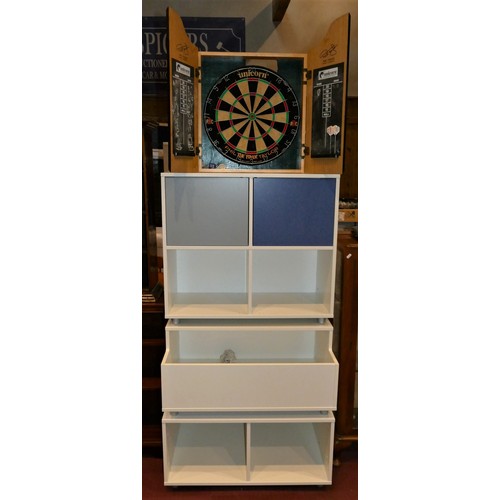157 - A modern three sectional modular storage unit, together with a 'Phil The Power Taylor' dartboard in ... 