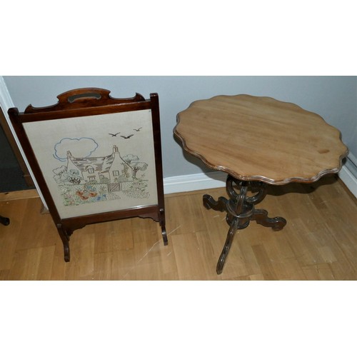 161 - A Victorian mahogany tilt-top tripod table, with scalloped edge top, carved pedestal on scrolled car... 
