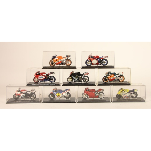 57 - A collection of 9 model motorcycles