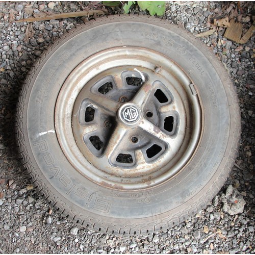 136 - A set of four MGB Rostyles wheels with assorted tyres