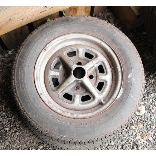 136 - A set of four MGB Rostyles wheels with assorted tyres