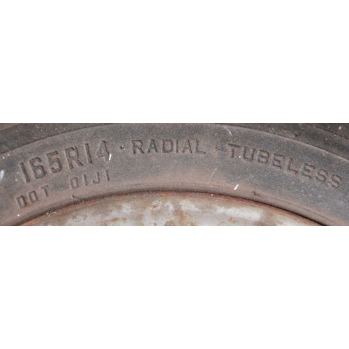 136 - A set of four MGB Rostyles wheels with assorted tyres