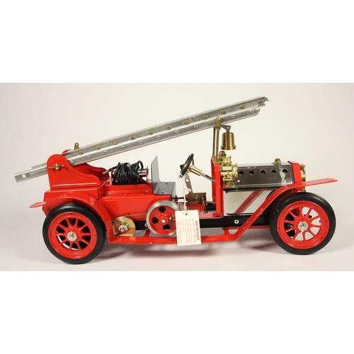 150 - A Mamod live steam 1404 Fire Engine FE1, depicting an Edwardian machine, 490 x 185 x 250mm, original... 