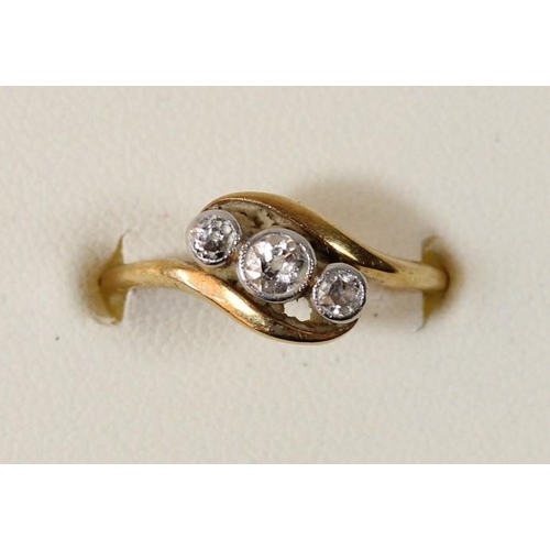 80 - An 18ct gold three stone diamond ring, centre stone chipped, O, 2.7gm
