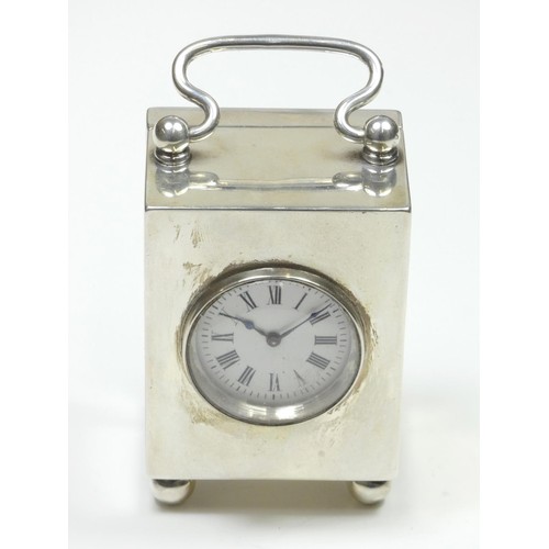 64 - A Victorian silver miniature carriage time piece, the 34mm white enamel dial with Roman numerals, Fr... 