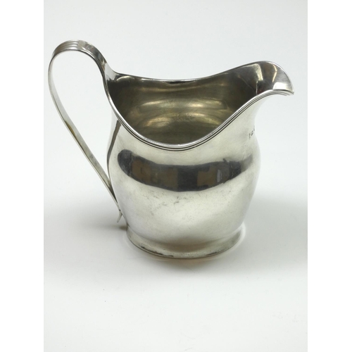 71 - A George III silver cream jug, by Peter, Ann and William Bateman, London 1804, with reeded border an... 