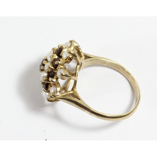 112 - A 9ct gold garnet and pearl cluster ring, O, 4.4gm