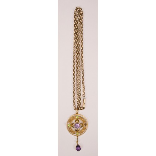 122 - Of Suffragette interest; an Edwardian 9ct gold amethyst and peridot pendant, with wreath border, len... 