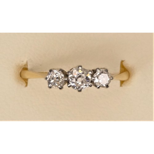 125 - An 18ct gold and three stone diamond ring, claw set with old cut stones, approximately 0.45cts in to... 