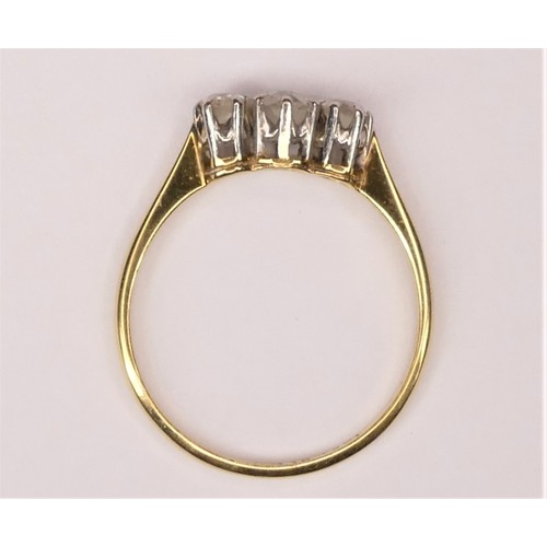 125 - An 18ct gold and three stone diamond ring, claw set with old cut stones, approximately 0.45cts in to... 