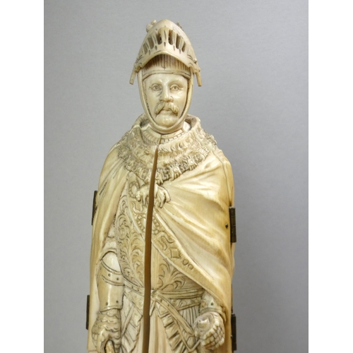 213 - A 19th century Dieppe ivory carved triptych figure of a French medieval nobleman with sword, his che... 