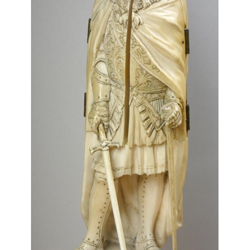 213 - A 19th century Dieppe ivory carved triptych figure of a French medieval nobleman with sword, his che... 