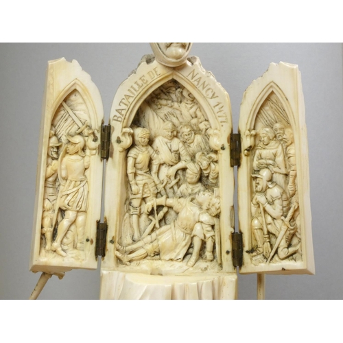 213 - A 19th century Dieppe ivory carved triptych figure of a French medieval nobleman with sword, his che... 