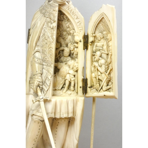 213 - A 19th century Dieppe ivory carved triptych figure of a French medieval nobleman with sword, his che... 