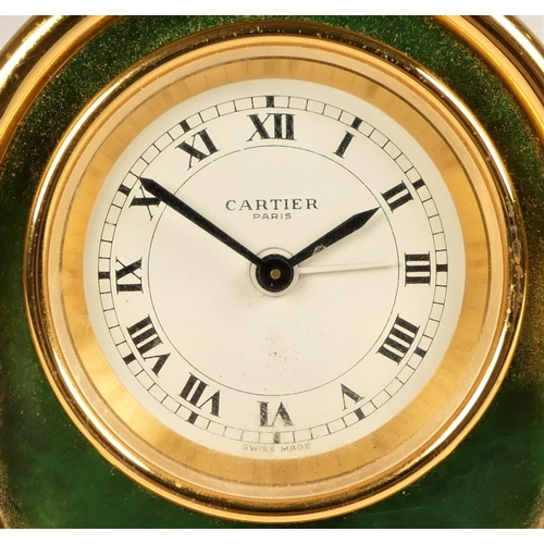 316 - Cartier, Paris, a brass and green enamel 7504 travel alarm clock, c.1990, the white enamel dial with... 