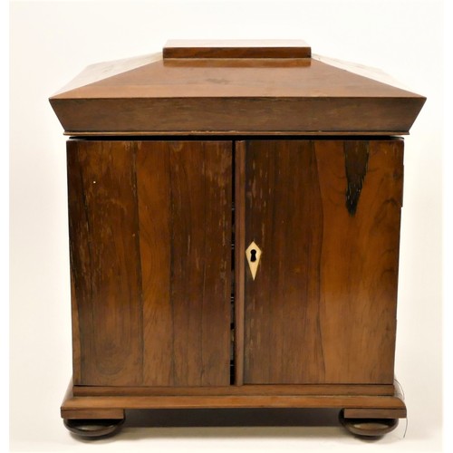 195 - A 19th century rosewood sewing box, the sarcophagus hinged lid opening to reveal a mirror and  fitte... 