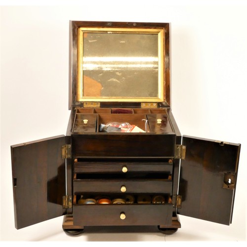 195 - A 19th century rosewood sewing box, the sarcophagus hinged lid opening to reveal a mirror and  fitte... 