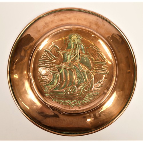 202 - Newlyn School, an Arts and Crafts embossed copper charger, decorated with a galleon, plain fold over... 