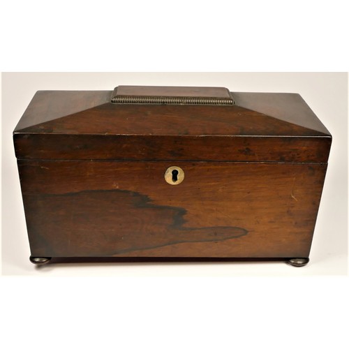 200 - A Regency rosewood tea caddy, the sarcophagus hinged lid opening to reveal a replacement glass mixin... 