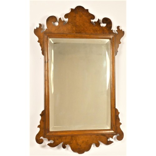 197 - A 19th century burr walnut and bevelled glass wall mirror, with scroll surmount and base, 65 x 39cm