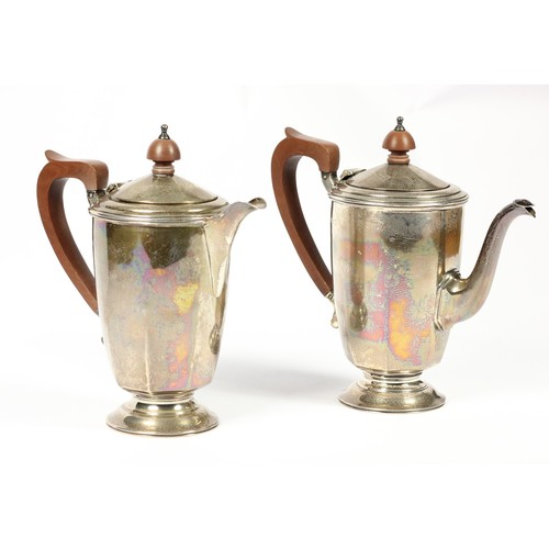 77 - A silver coffee pot and hot milk jug, by Mappin & Webb, Birmingham 1935, Coronation duty mark, of pa... 