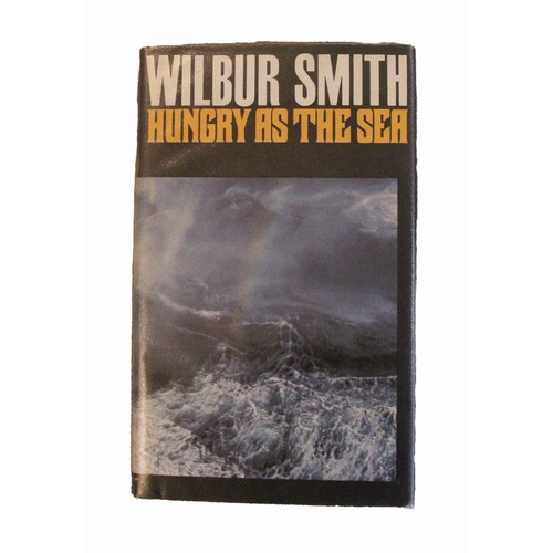 160 - Wilbur Smith. When The Lion Feeds. William Heinemann. 1st edition 1964. Dust wrapper. Signed by auth... 