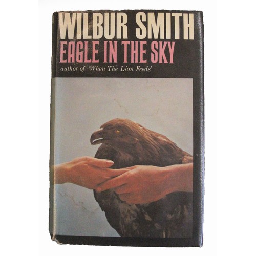 160 - Wilbur Smith. When The Lion Feeds. William Heinemann. 1st edition 1964. Dust wrapper. Signed by auth... 