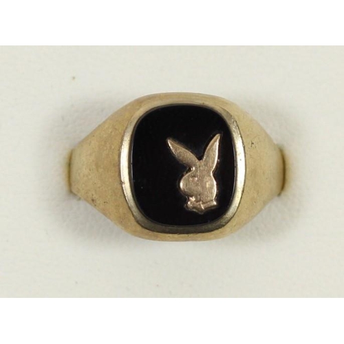 A 9ct gold and onyx signet ring, with Playboy motif, S, 3.3gm