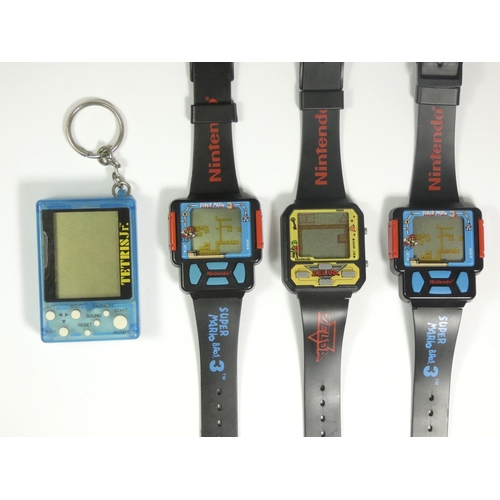 61 - Three Nintendo licensed Game Watches, two Super Mario Bros. 3, and Zelda, also including a Tetris Jr... 