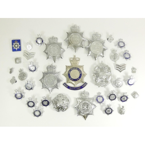 98 - A collection of thirty six Police cap and pin badges, mainly from Northern forces, including Leeds C... 