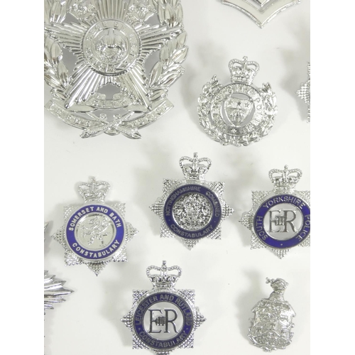 98 - A collection of thirty six Police cap and pin badges, mainly from Northern forces, including Leeds C... 