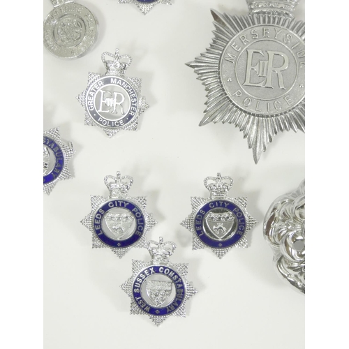 98 - A collection of thirty six Police cap and pin badges, mainly from Northern forces, including Leeds C... 