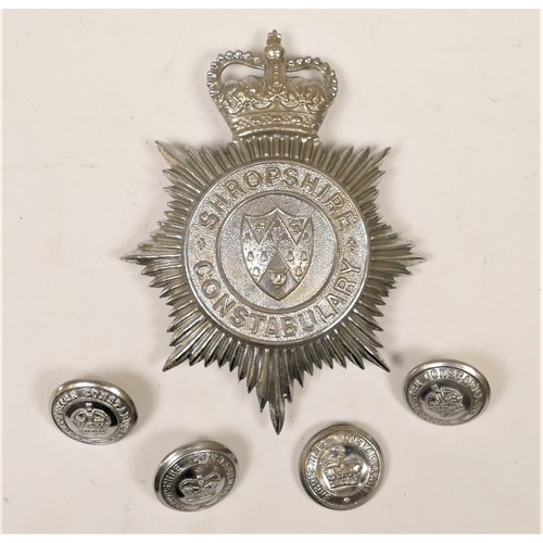 105 - A Shropshire Constabulary helmet badge, Queen's Crown, together with four matching buttons (5)