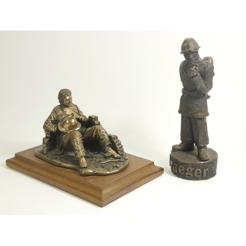 106 - A bronzed figure 'fireman at rest', by A.Miller 1981, signed and dated, on a wooden plinth, together... 