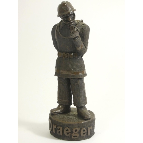 106 - A bronzed figure 'fireman at rest', by A.Miller 1981, signed and dated, on a wooden plinth, together... 