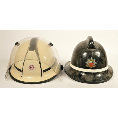 110 - Two South Yorkshire Police helmets, together with two fire helmets, Humberside Fire Brigade, with fi... 