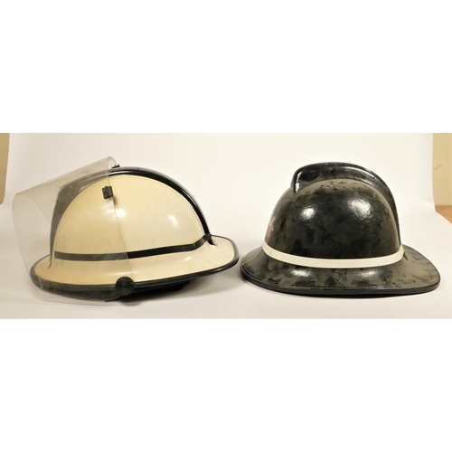 110 - Two South Yorkshire Police helmets, together with two fire helmets, Humberside Fire Brigade, with fi... 