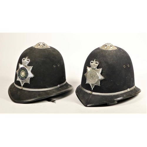 110 - Two South Yorkshire Police helmets, together with two fire helmets, Humberside Fire Brigade, with fi... 