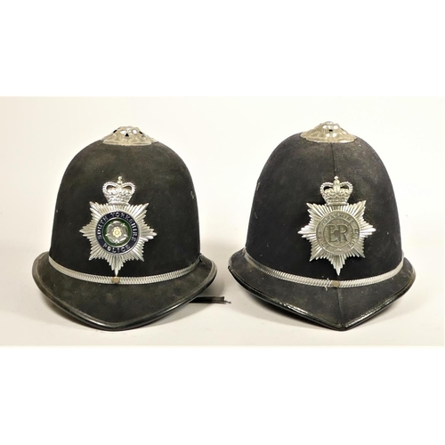 110 - Two South Yorkshire Police helmets, together with two fire helmets, Humberside Fire Brigade, with fi... 