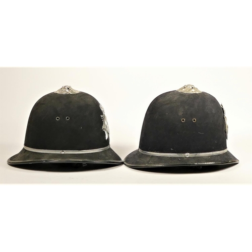 110 - Two South Yorkshire Police helmets, together with two fire helmets, Humberside Fire Brigade, with fi... 