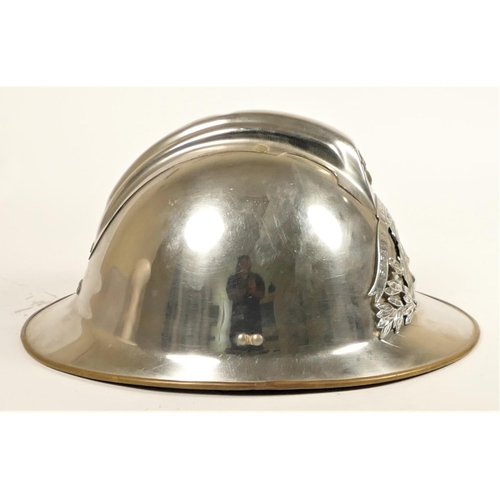 113 - A French fire helmet, chromed brass with Sapeurs Pompiers De L'essonne crest, fitted leather cap wit... 